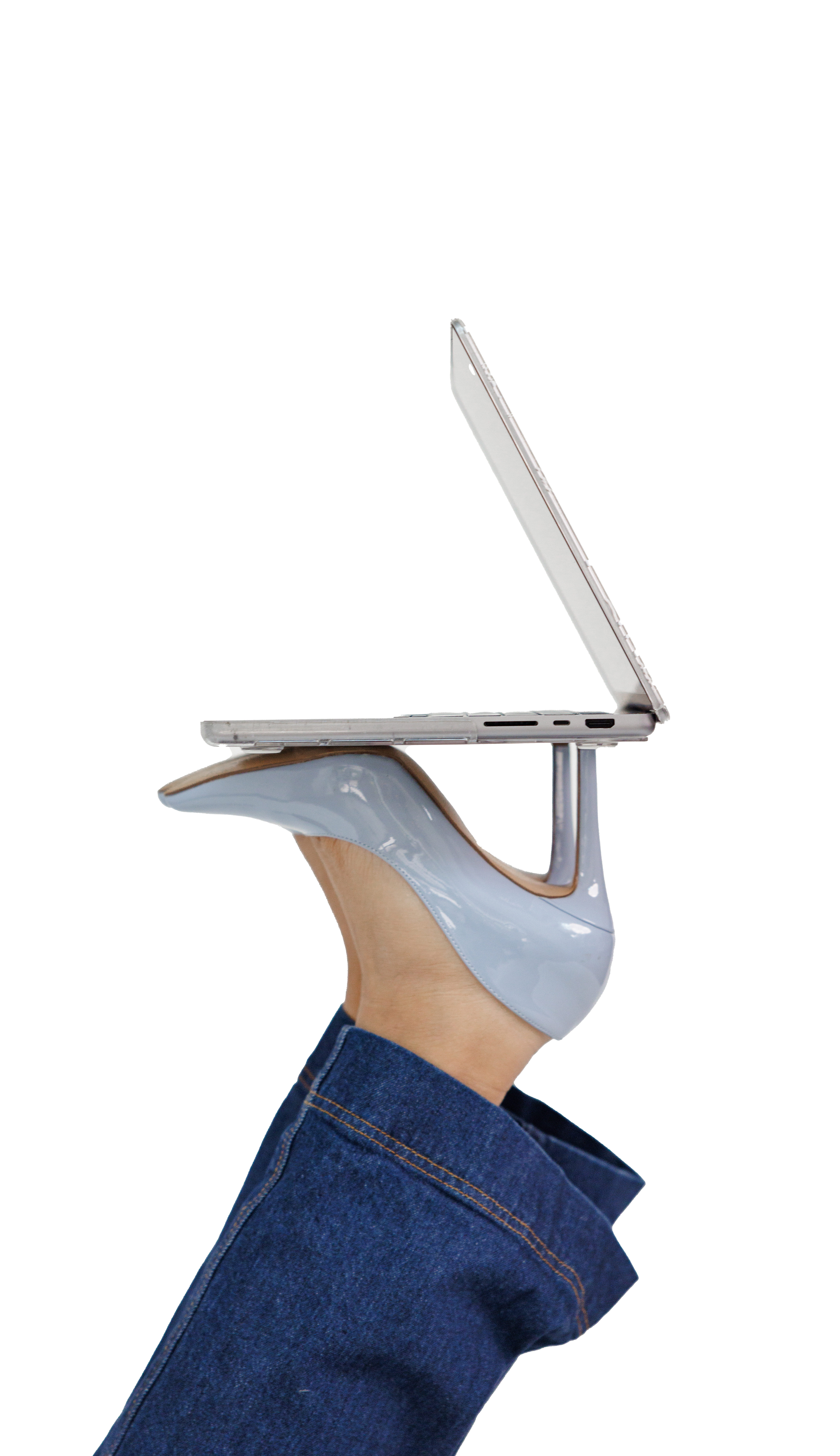 Laptop balanced on a high heel shoe representing the blend of tech and personal touch in strategic partnerships